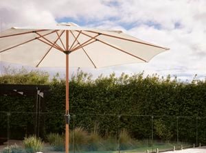 Outdoor area with outdoor lounge, umbrella and swimming pool