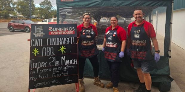 TMs in front of a sausaze sizzle bbq