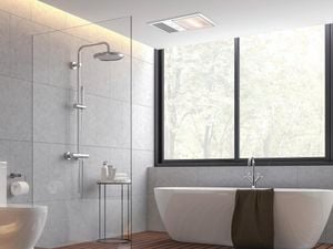 Modern bathroom with frameless glass and white bathtub
