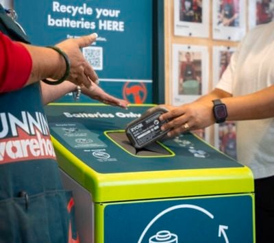 customer recycling old battery at bunnings store