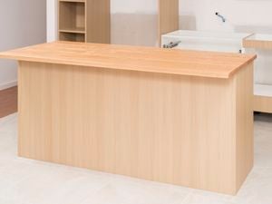 The image shows a kitchen timber island benchtop neatly installed on a tiled floor.