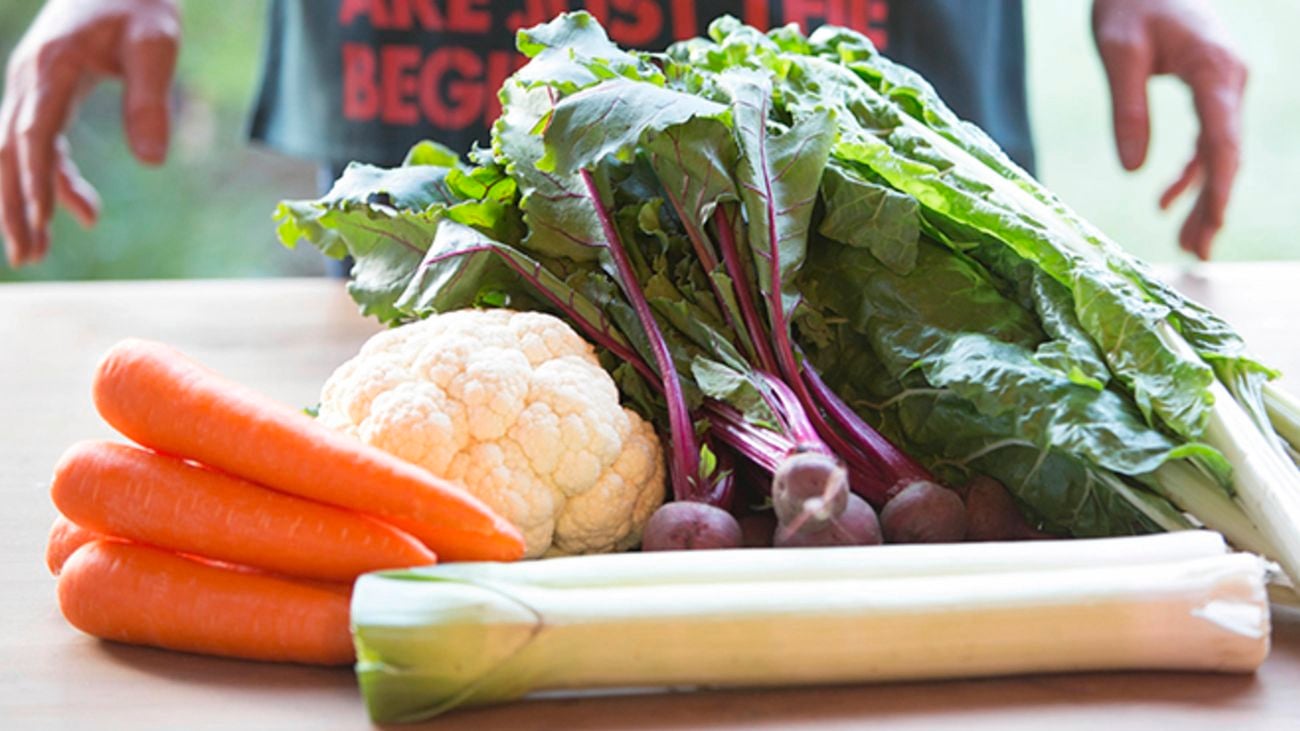 Harvested vegetables including carrots, beetroot and leeks.