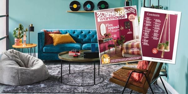Tilted front cover of the NZ Bunnings magazine Autumn 2025 and bedroom in shot