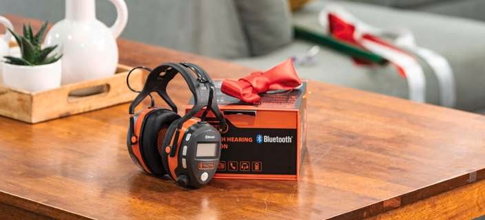 Blue tooth headset sitting on a coffee table