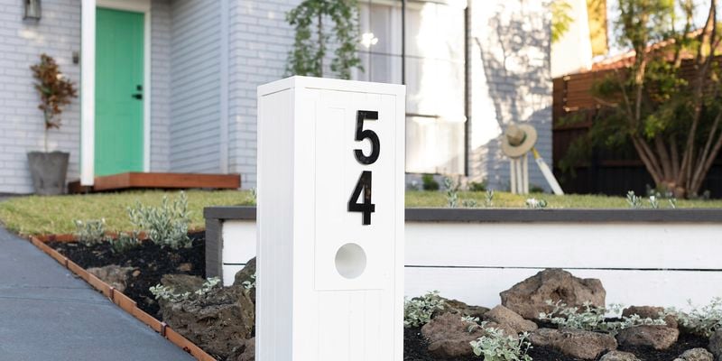 Letterbox at the front of a house with the number 54