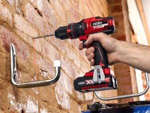 Using an Ozito drill and bit to drill into a brick wall and mount a bike hook