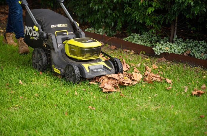 HP Brushless Cordless Lawn Mower machine in the garden.