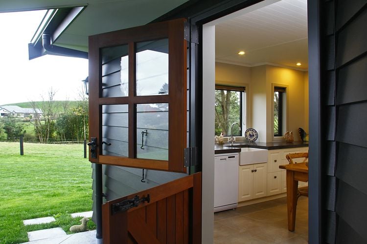 Rear entry to home with split timber door where top half and bottom half can be closed and opened separately