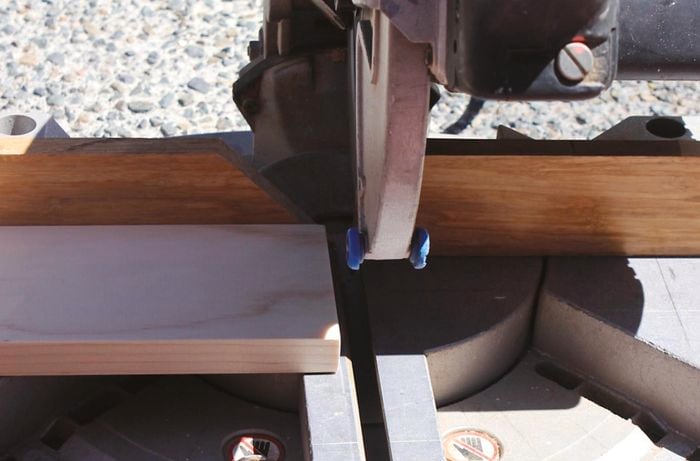 Cutting two pieces of timber for a dowel Christmas tree crossbar