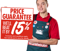 A Bunnings Team Member holding a sign that says Price Guarantee we'll beat it by 15%.