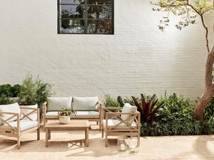 Outdoor area with timber outdoor setting.