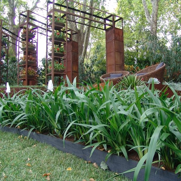 Plant edging with plants and rustic garden features.