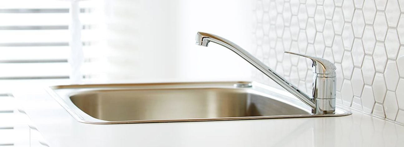Stainless steel kitchen sink and tap
