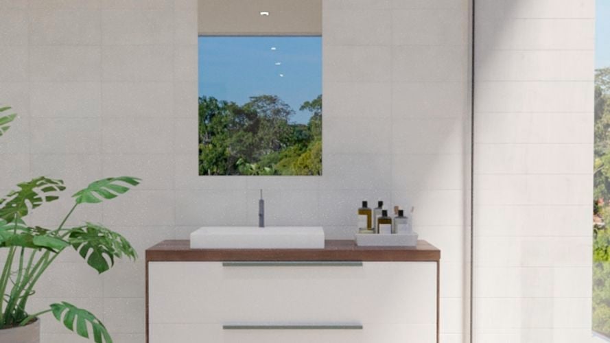 Bathroom with mirror along with wash basin, storage shelf, pull drawer and white wall tiles.