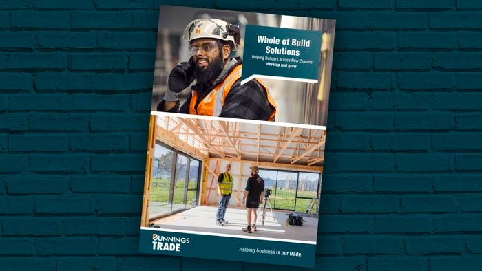 Whole of Build brochure on a Bunnings green brick background