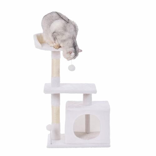 A cat playing on a 2 tier cat playhouse.