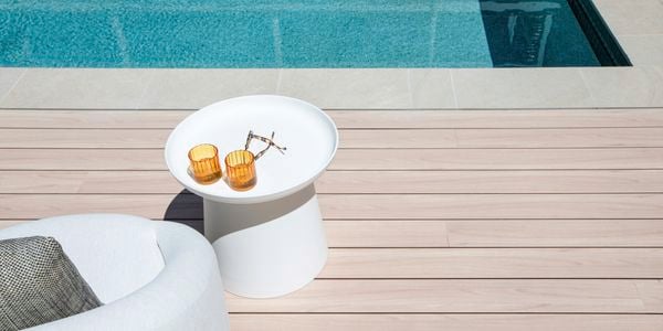 Outdoor pool surrounded by birch coloured DECO decking