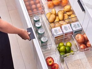 white kitchen draws with potatoes, cans and veg's