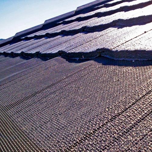 Close up of a roof image with an installed gutter mesh.