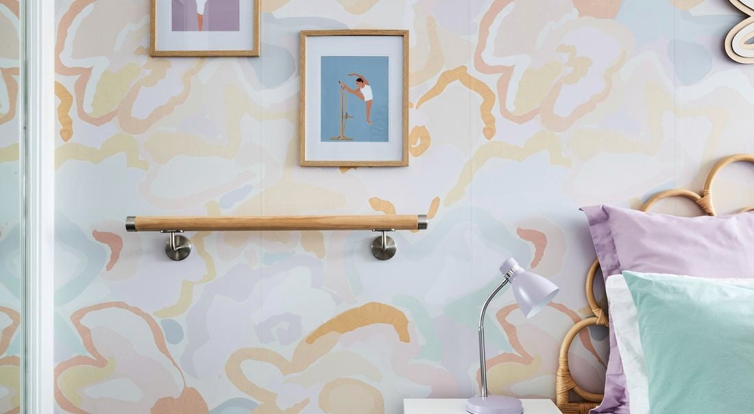 Image of room for kids with colourful wall and ballet barre installed