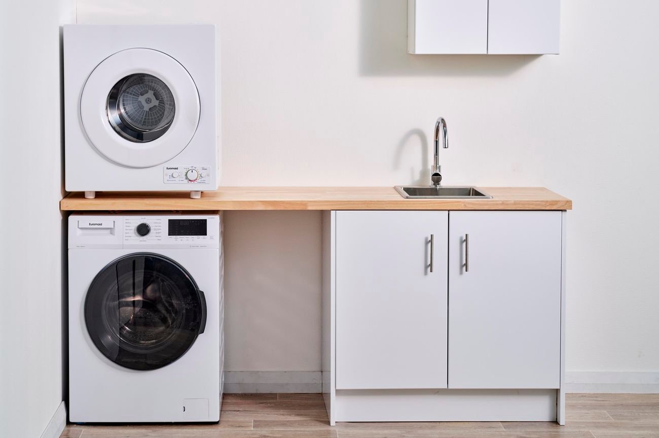 Small laundry with timber bench an overhead dryer.
