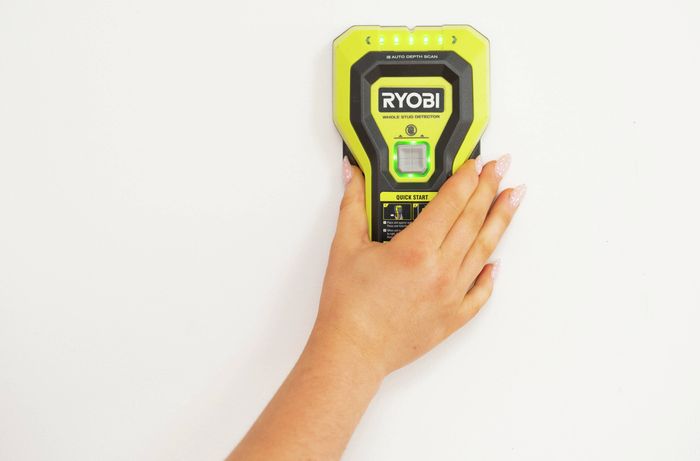 Stud finder is used to locate timber studs behind plasterboard walls.