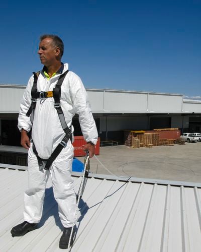 tradesperson working on a ladder