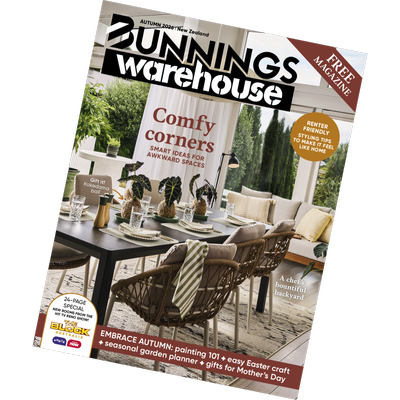 Magazine cover titled ‘Bunnings Warehouse.’ The feature story headline reads ‘Comfy corners – Smart ideas for awkward spaces.’ The cover shows a styled dining area with a black table, woven chairs, decorative plants, and a lounge area with light cushions in a bright, greenery‑filled indoor–outdoor space.