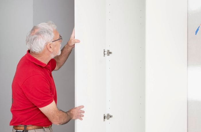 Reattach the doors for the pantry back onto the hinge plates