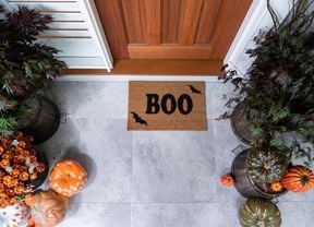 Front door mat with the words Boo stencilled on it