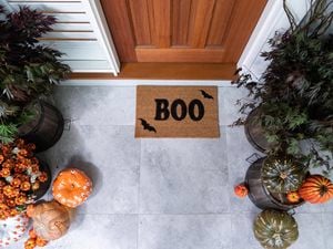 Front door mat with the words Boo stencilled on it