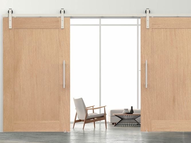 Living room interior featuring Rolltrak Satin Nickel Side Mount Barn Door Track, 400mm Stainless Steel Round Single Pull Handle, Stainless Steel Barn Door Guide and Satin Nickel Track Joiner.