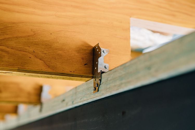 Corner bracket joining two beams at right angles