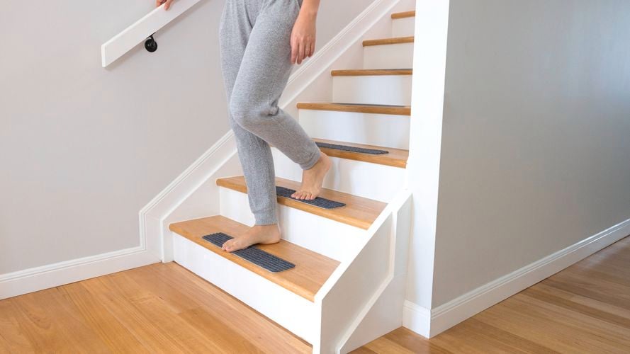 Person walking down stairs.