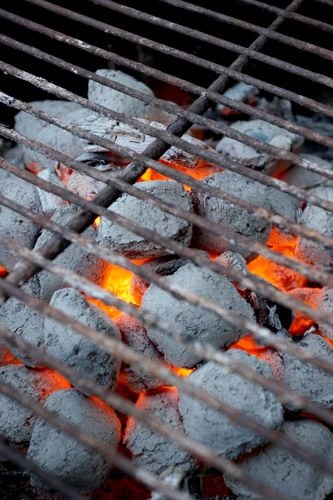 Closeup of heat beads under a grill