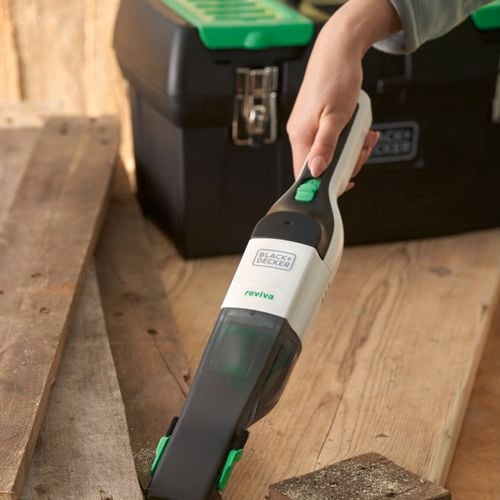 hand vac being used to clean 