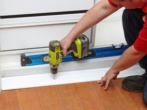 DIY Step Image - How to install a sliding wardrobe door . Blob storage upload.