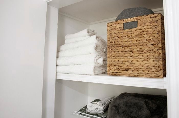 Towels and basket on a shelf