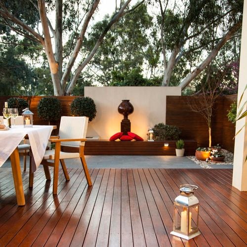 Outdoor decking area with water feature.