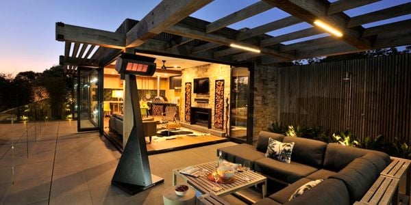 Outdoor entertaining deck with outdoor heating and furniture