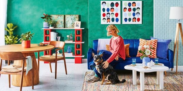 Bright living room with blue couch.