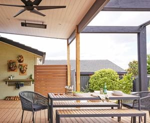 A wooden deck with outdoor furniture.