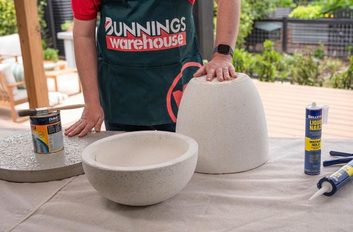 Two plant pots sitting on top of a table.