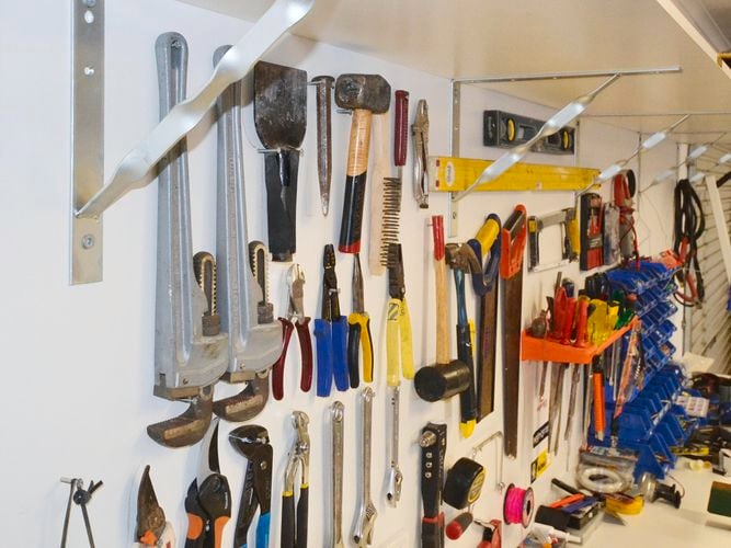 A garage with tools on the wall
