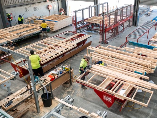 Frame and truss work site showcasing timber roof stusses been made