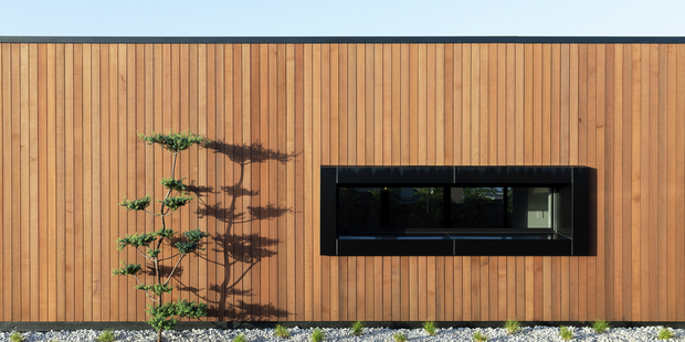 Wood panelled exterior of a house with single window.