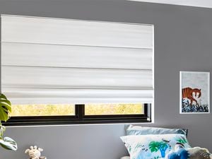 Indoor roman blinds and a window
