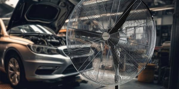 Car being worked on with fan in prime shot