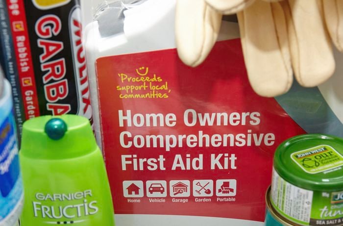 A first aid kit, garbage bags, canned tuna and shampoo bottle