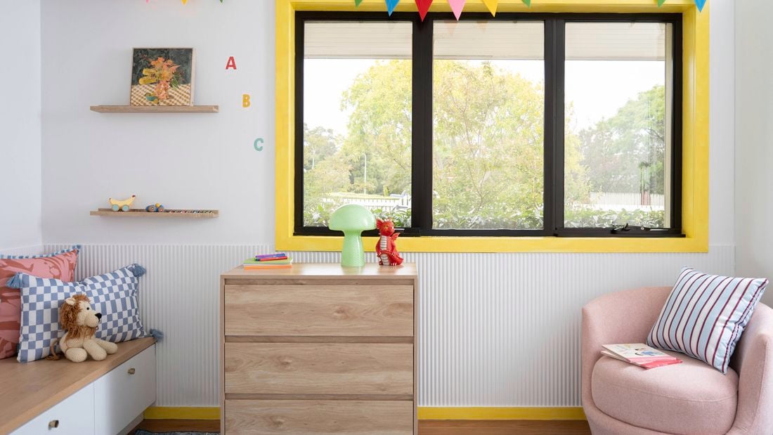 Playful kid-core window trims brighten a children’s space